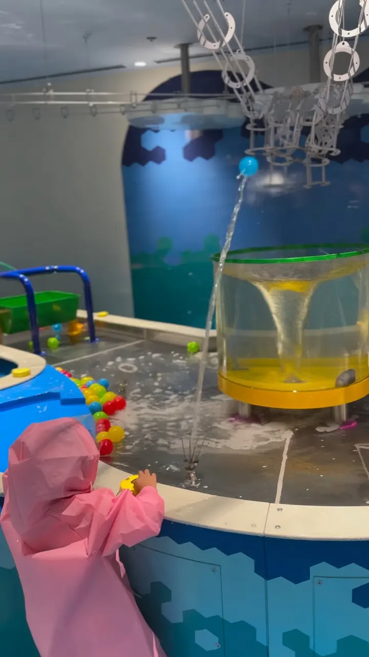 Water play area with themed portholes