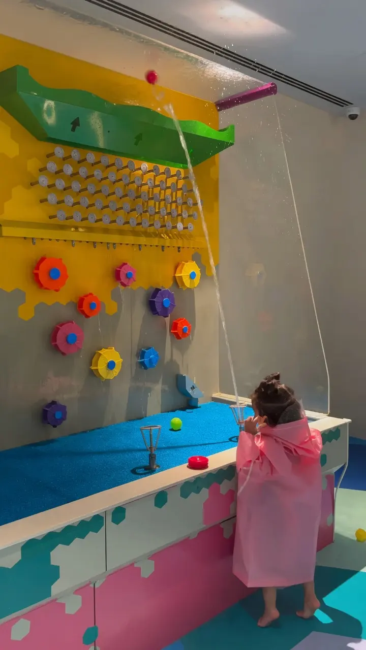 Child sending balls through the probability wall